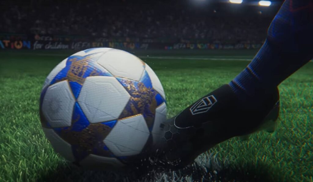 totul despre cel mai realist joc de fotbal În imagine se vede un picior de jucător care lovește o minge de fotbal aflată pe gazonul unui stadion